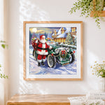 Finished santa claus with green vintage car cross stitch artwork displayed