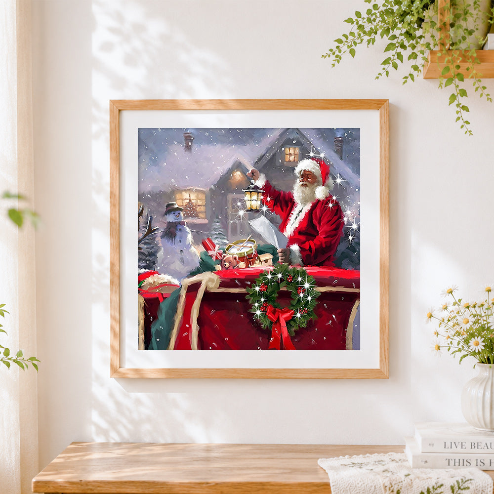 Finished santa claus with lantern and snowman cross stitch artwork displayed