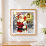 Finished santa claus with lantern cross stitch artwork displayed
