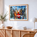 Santa claus with reindeer and lantern cross stitch artwork displayed on wall as home decor