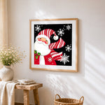 Santa claus with striped hat and snowflakes paint by numbers artwork displayed on wall as home decor