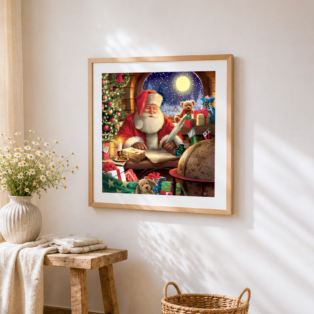 Santa claus writing letters by moonlight cross stitch artwork displayed on wall as home decor