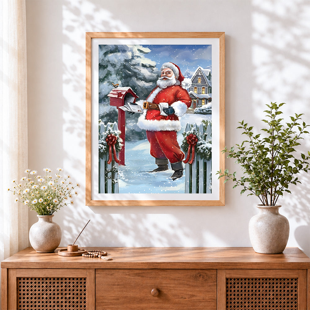 Finished santa collecting letters from a red postbox cross stitch artwork displayed