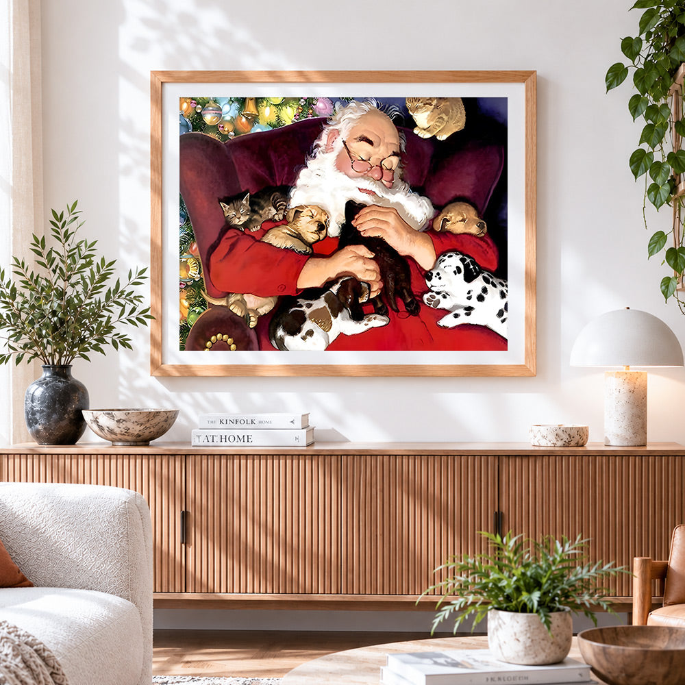 Finished santa cuddling puppies and kittens cross stitch artwork displayed