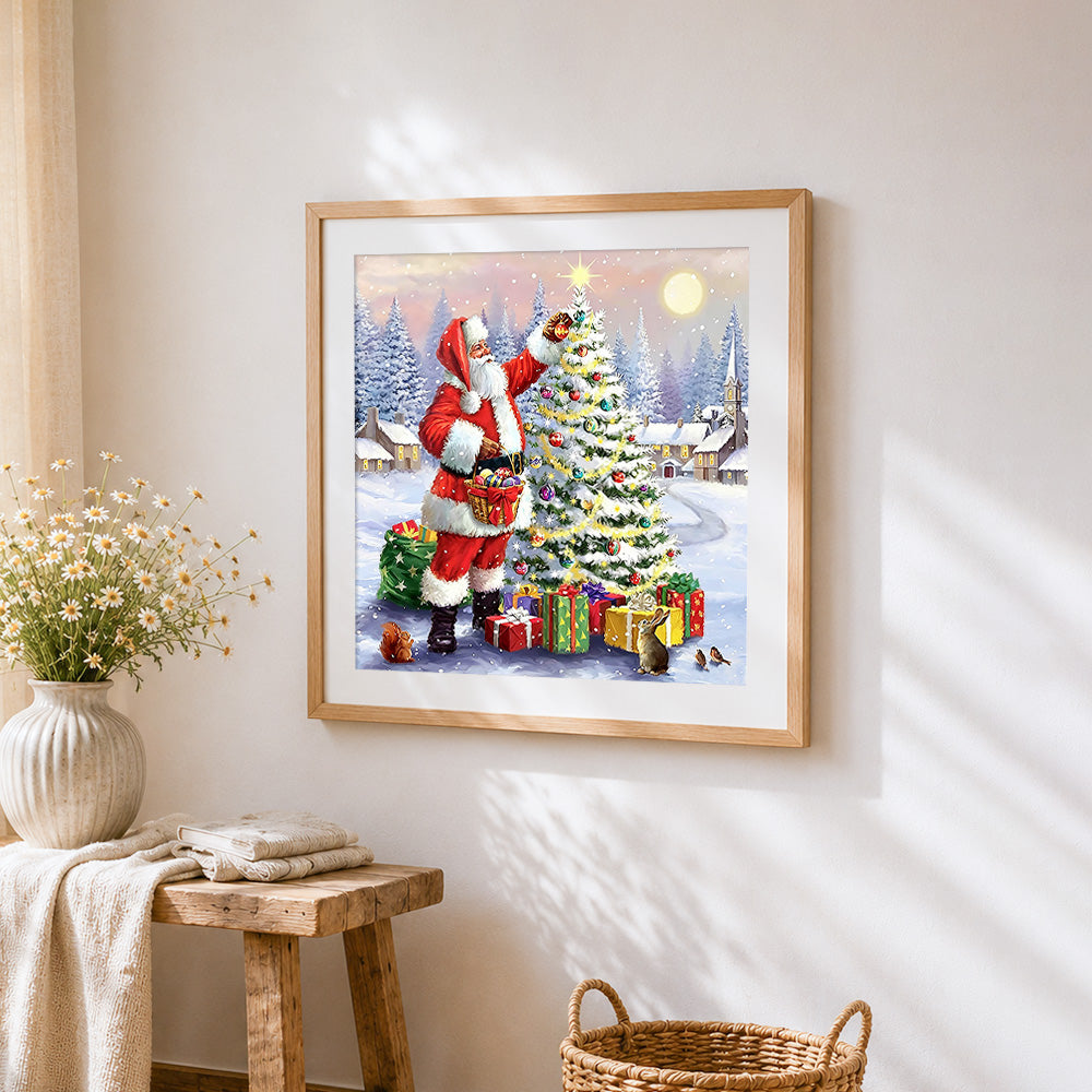 Santa decorating a snowy christmas tree cross stitch artwork displayed on wall as home decor