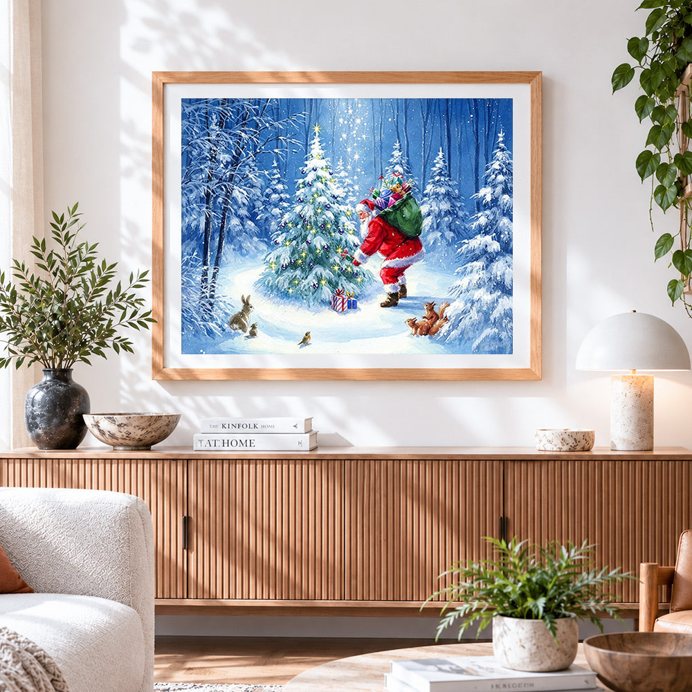 Finished santa decorating tree with wildlife cross stitch artwork displayed