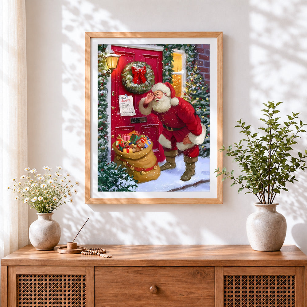 Finished santa delivering presents at red door cross stitch artwork displayed
