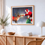 Santa feeding reindeer a treat cross stitch artwork displayed on wall as home decor