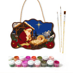 Santa kneels in prayer paint by numbers door hanger with paints and brushes