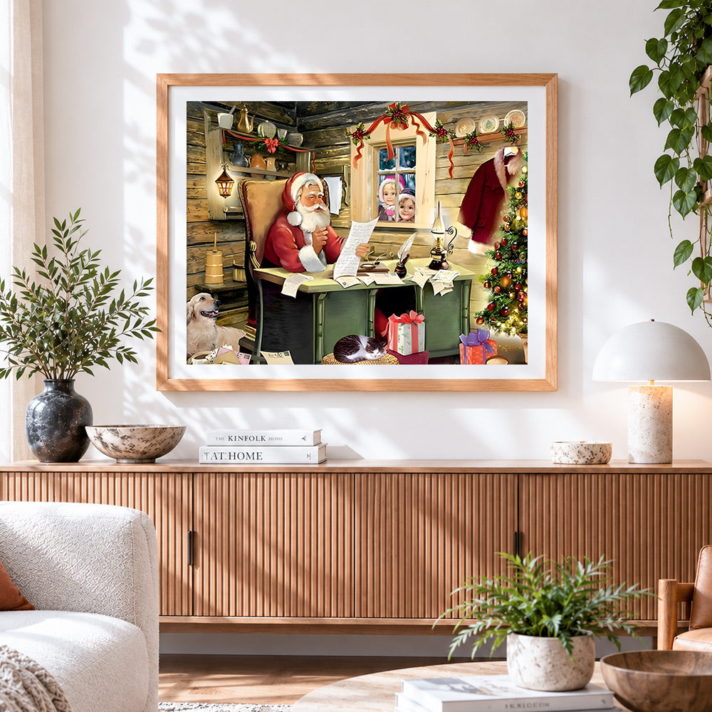 Finished santa reading letters in cosy log cabin cross stitch artwork displayed