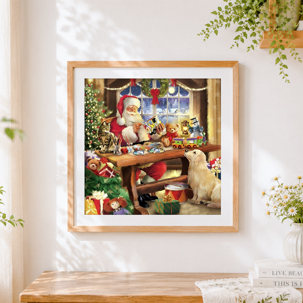Finished santa's workshop making toys cross stitch artwork displayed
