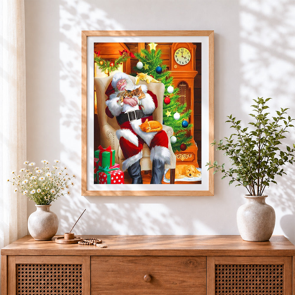 Finished santa sleeping with kittens cross stitch artwork displayed