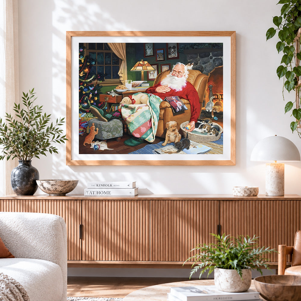 Finished santa sleeping with puppies cross stitch artwork displayed