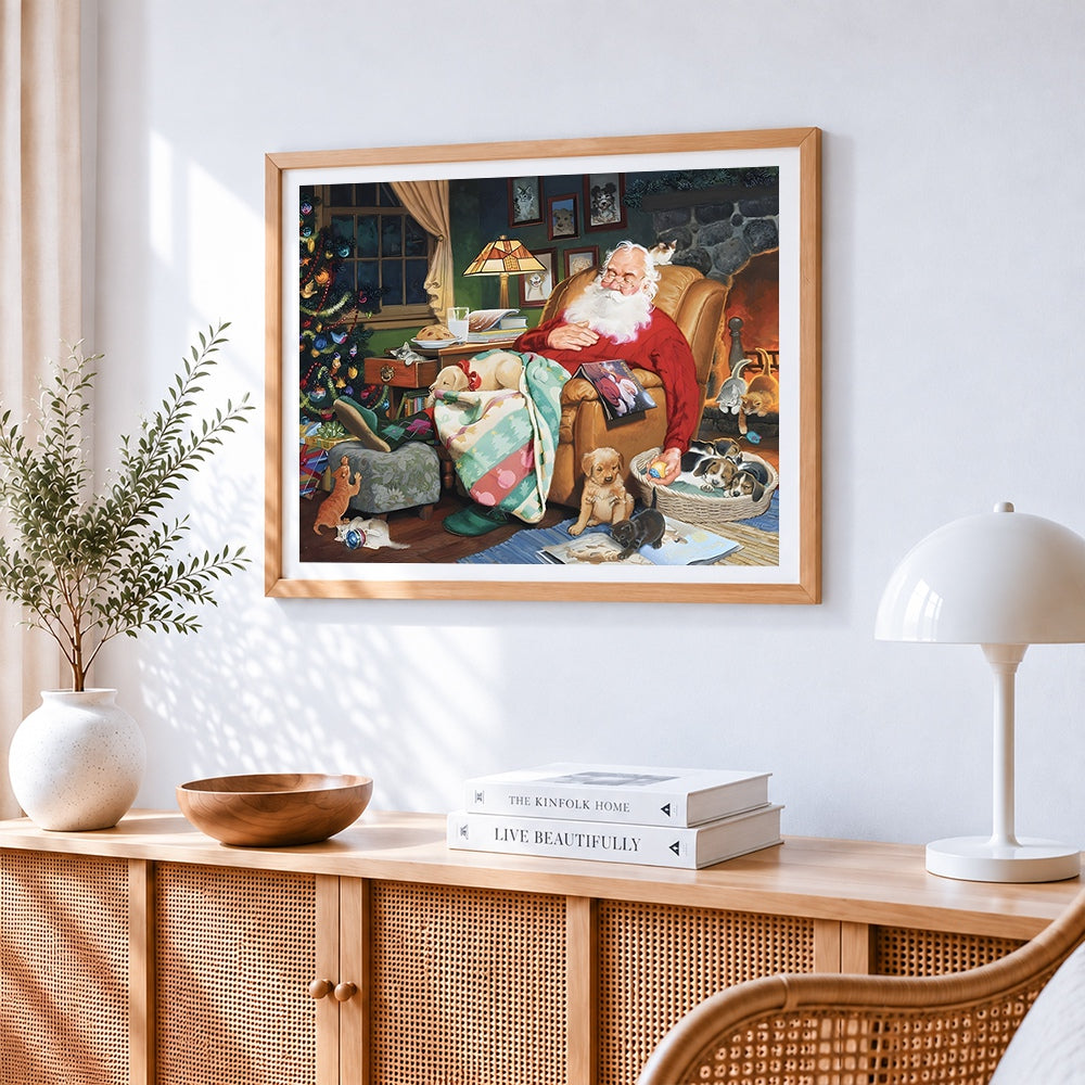 Santa sleeping with puppies cross stitch artwork displayed on wall as home decor