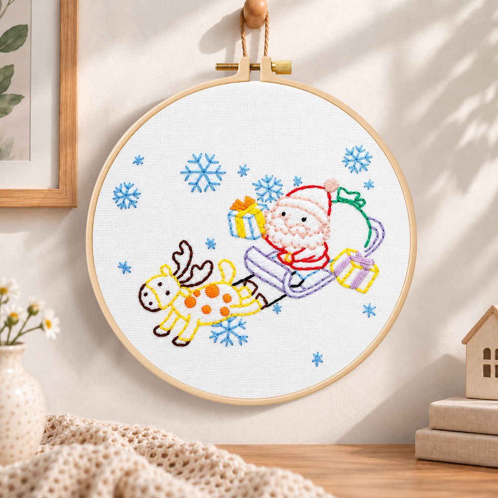 Santa sleigh ride embroidery hoop wall art displayed as warm and cosy handmade home decor
