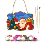Santa waving by christmas tree paint by numbers door hanger with paints and brushes
