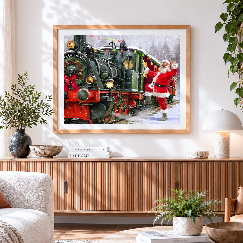 Finished santa waving by festive train cross stitch artwork displayed