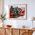 Santa waving by festive train cross stitch artwork displayed on wall as home decor