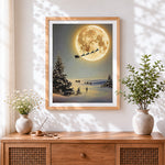 Finished santa's sleigh flying across a full moon cross stitch artwork displayed