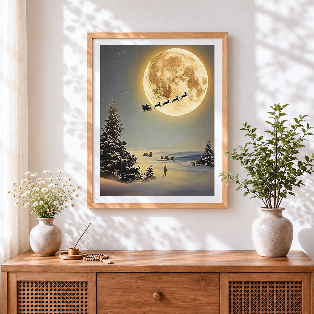 Finished santa's sleigh flying across a full moon cross stitch artwork displayed