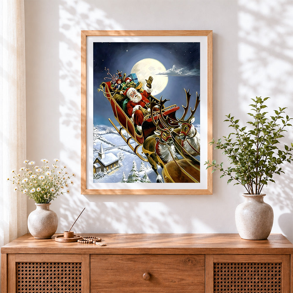 Finished santa's sleigh flying over a snowy church cross stitch artwork displayed