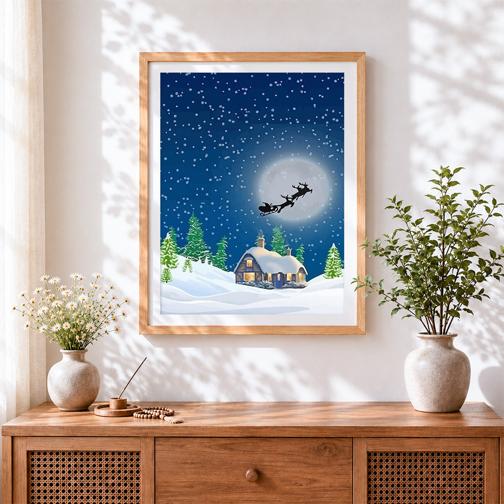 Finished santa's sleigh flying over a snowy cottage cross stitch artwork displayed