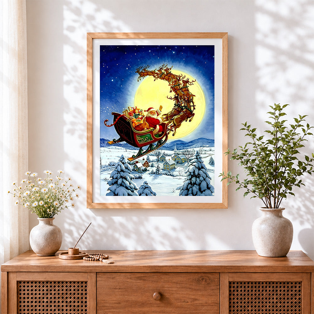 Finished santa's sleigh flying over the full moon cross stitch artwork displayed