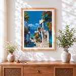 Finished santorini blue and white alleyway cross stitch artwork displayed