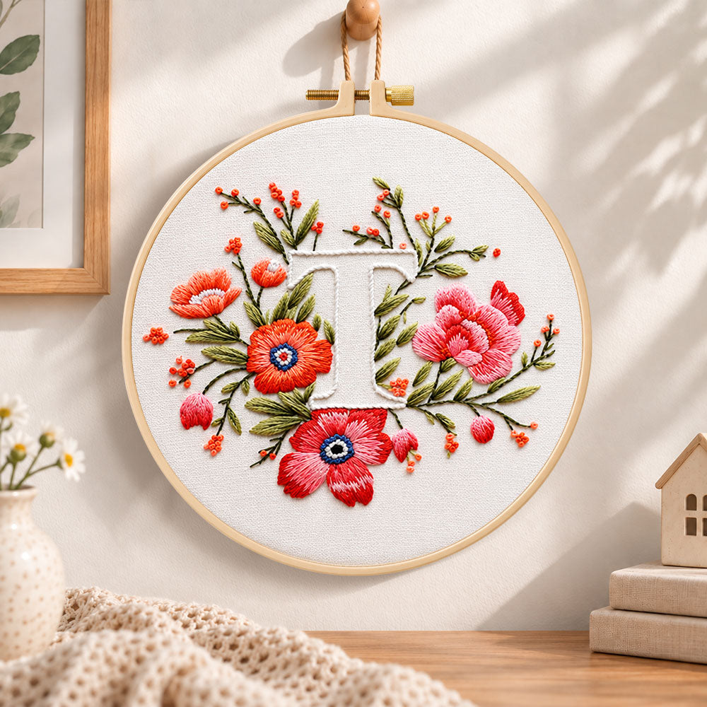 Scarlet florals and letter t embroidery hoop wall art displayed as warm and cosy handmade home decor