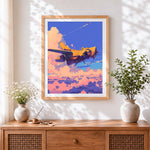 Finished sci-fi yellow spaceship in pink clouds cross stitch artwork displayed