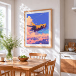 Sci-fi yellow spaceship in pink clouds cross stitch artwork displayed on wall as home decor