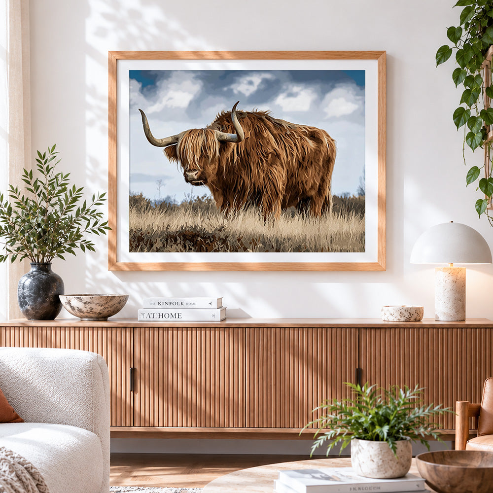 Finished scottish highland cow in field cross stitch artwork displayed