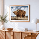 Scottish highland cow in field cross stitch artwork displayed on wall as home decor