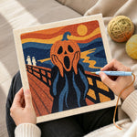Creating handmade screaming pumpkin art punch needle artwork