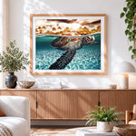 Finished sea turtle swimming cross stitch artwork displayed