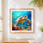 Finished sea turtle swimming underwater cross stitch artwork displayed