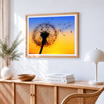 Seeds blowing in the wind cross stitch artwork displayed on wall as home decor