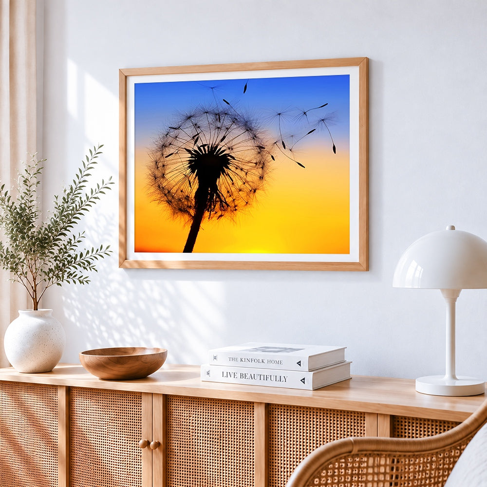 Seeds blowing in the wind cross stitch artwork displayed on wall as home decor