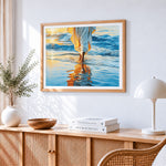 Serene figure walking on beach cross stitch artwork displayed on wall as home decor