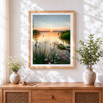 Finished serene wildflower lake cross stitch artwork displayed