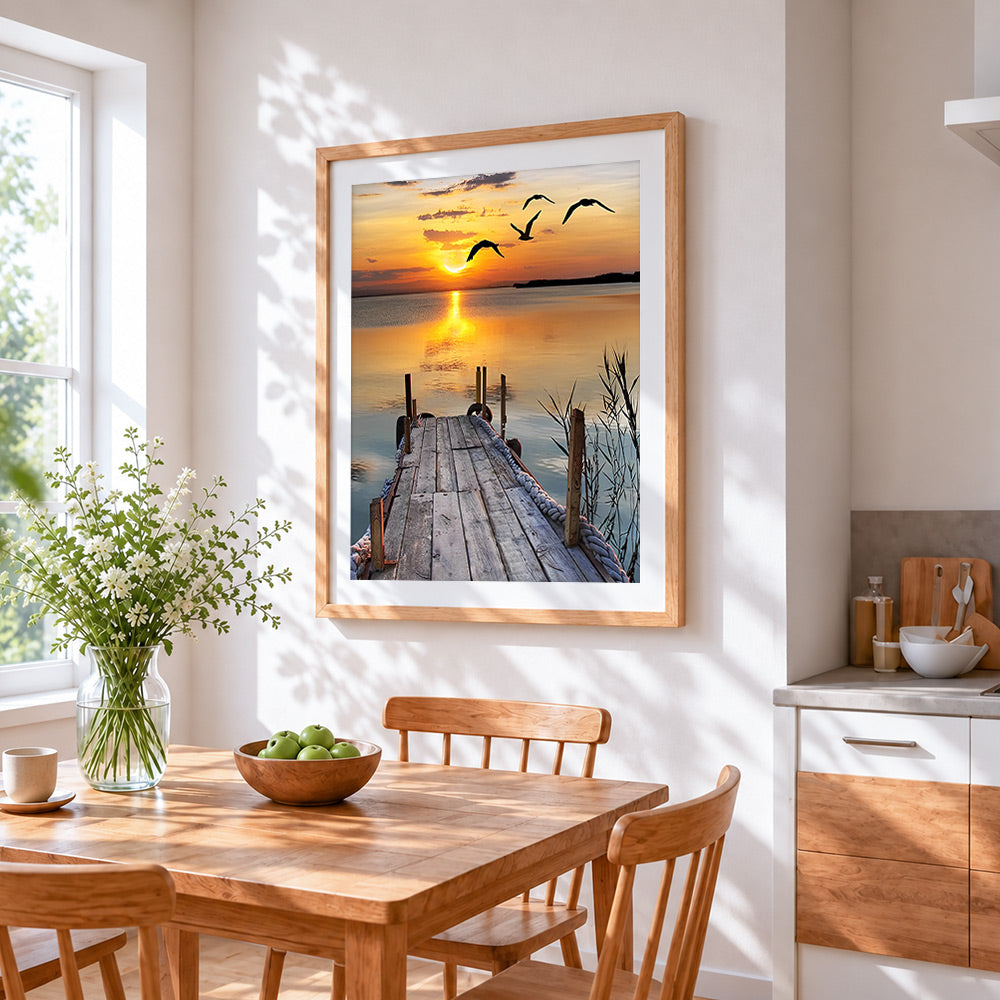 Serene wooden pier sunset cross stitch artwork displayed on wall as home decor