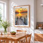 Serene wooden pier sunset cross stitch artwork displayed on wall as home decor