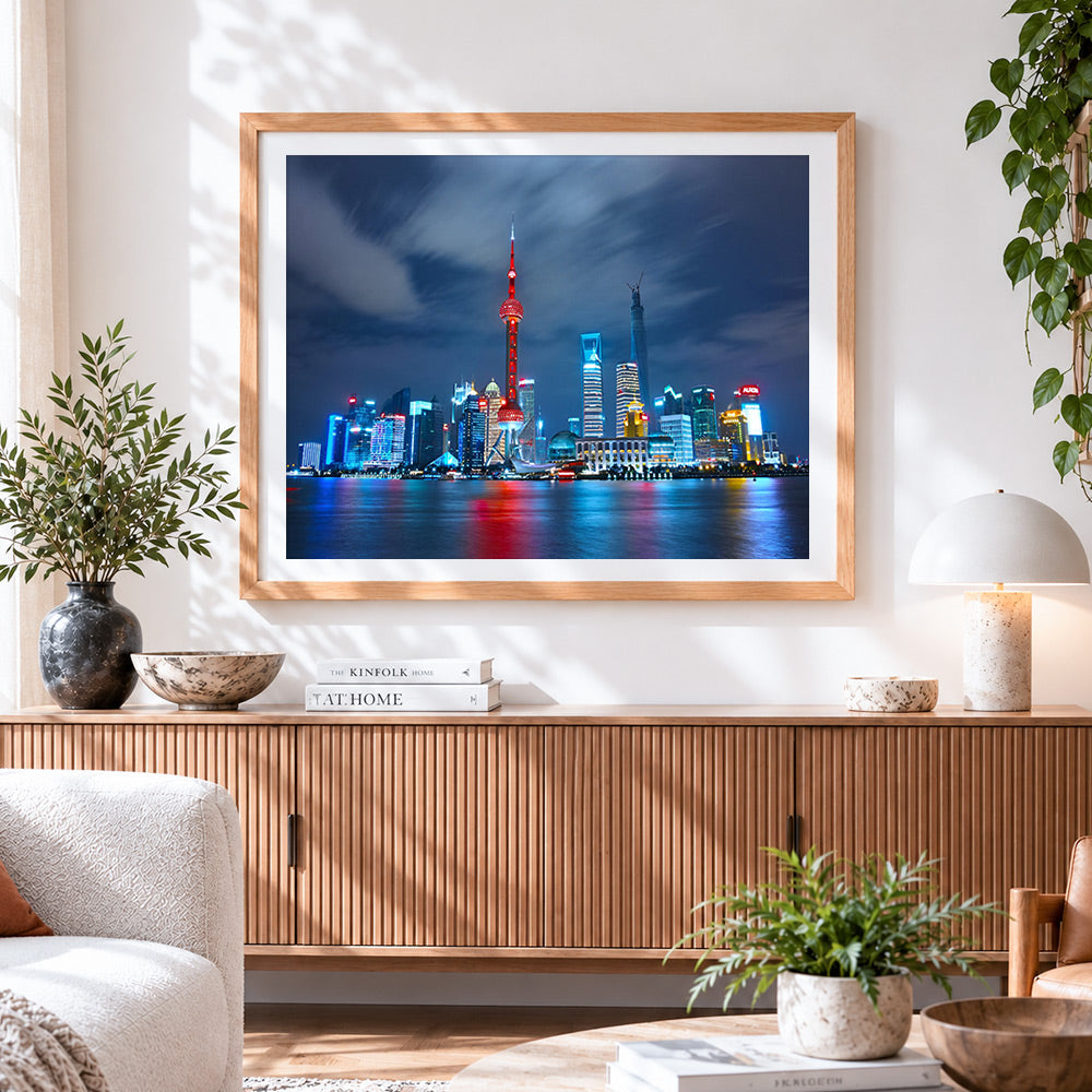 Finished shanghai skyline at night cross stitch artwork displayed