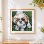 Finished shih tzu puppy portrait cross stitch artwork displayed