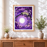 Finished siamese cat and cherry blossom cross stitch artwork displayed