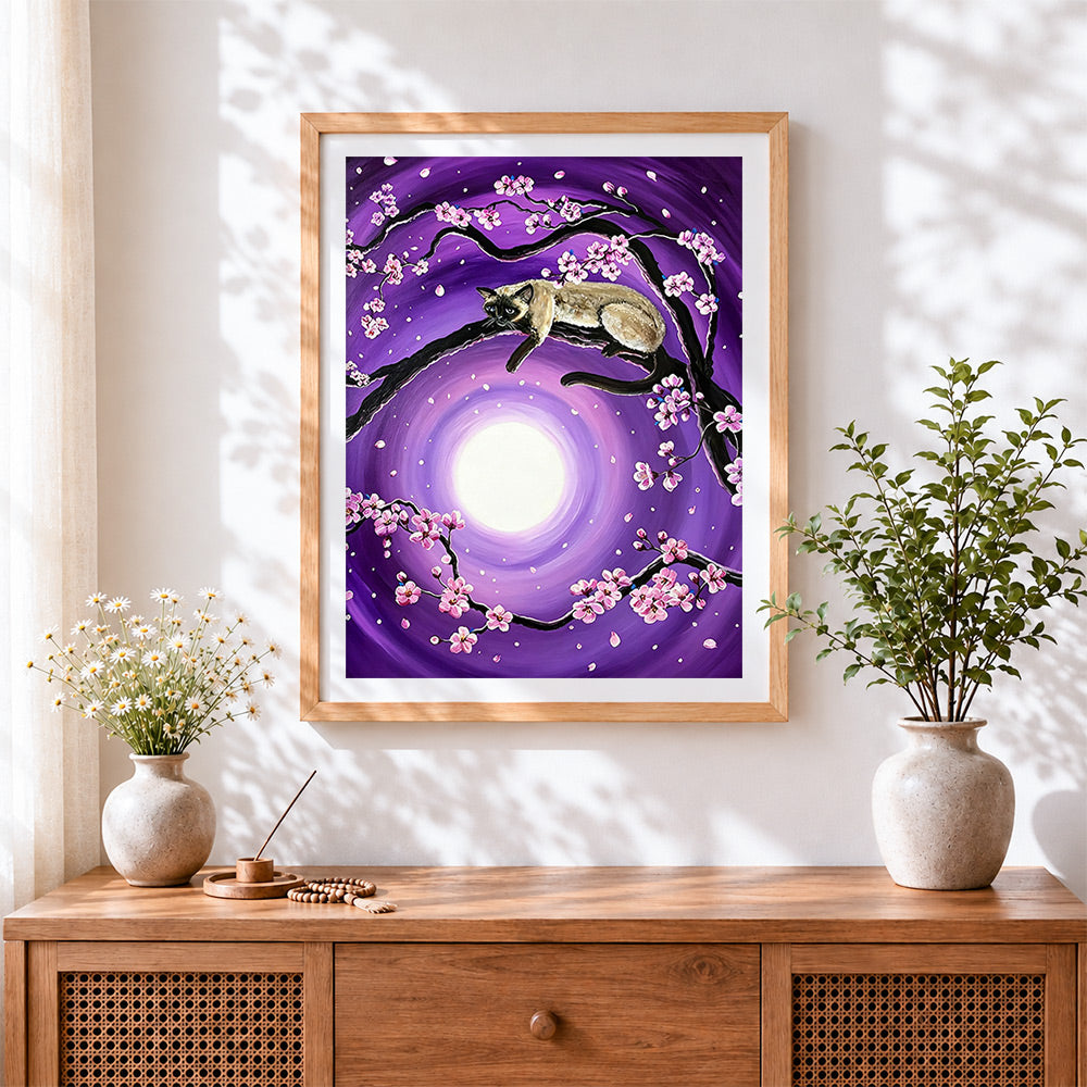 Finished siamese cat and cherry blossom cross stitch artwork displayed