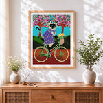 Finished siamese cat riding a bicycle paint by numbers artwork displayed as home decor