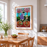 Siamese cat riding a bicycle paint by numbers artwork displayed on wall as home decor