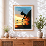 Finished silhouette of a girl by a boat at sunset paint by numbers artwork displayed as home decor