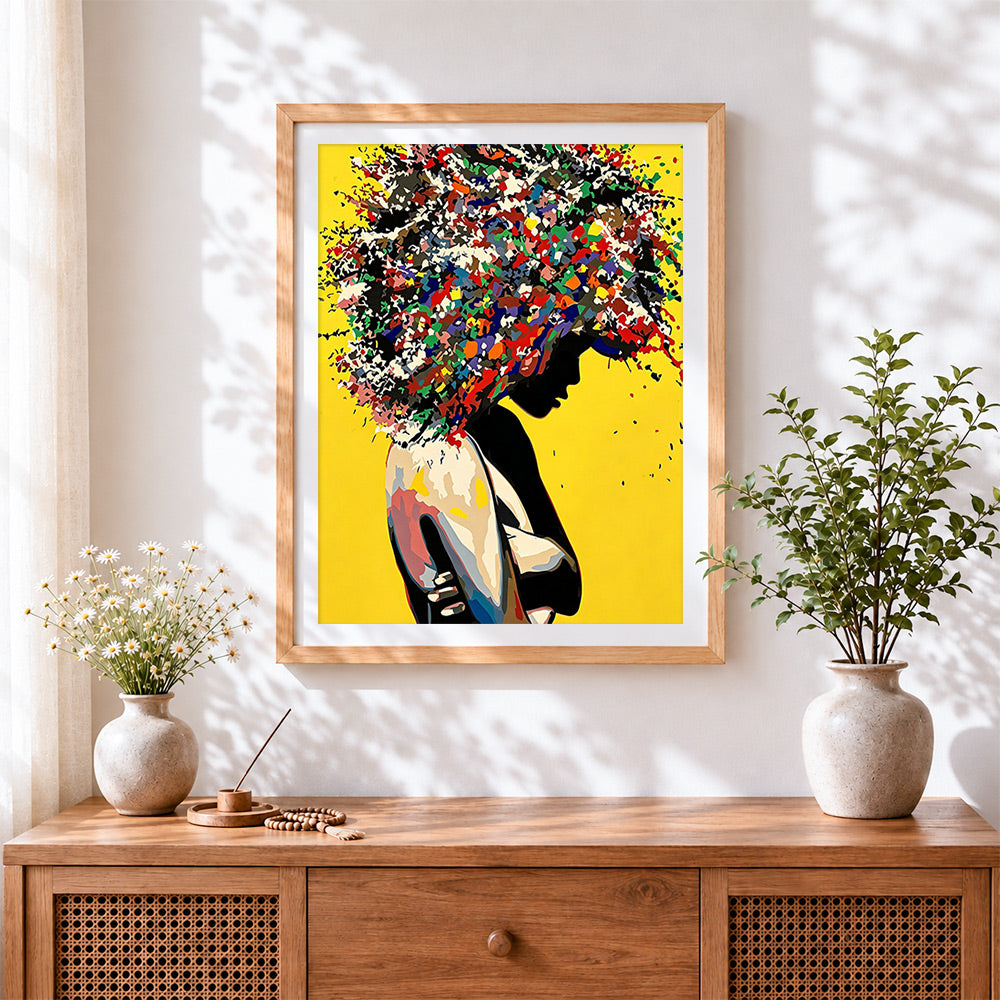 Finished silhouette with colourful afro hair cross stitch artwork displayed